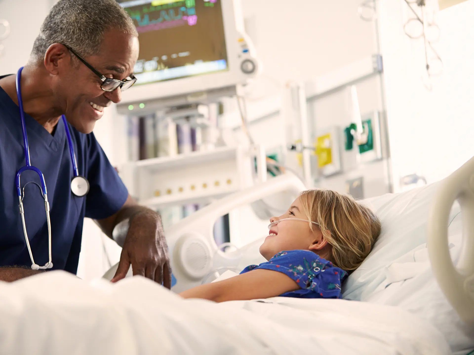Doctor examines a hospitalised girl