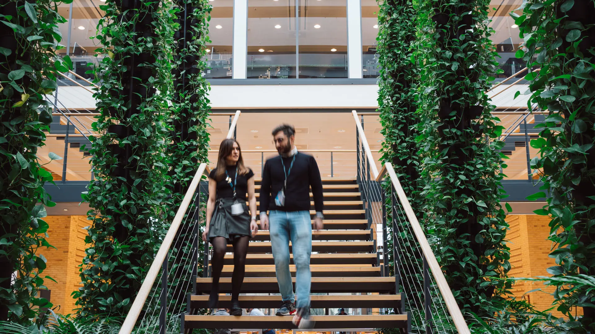 Systematic employees walking on stairs in Systematic Headquarters
