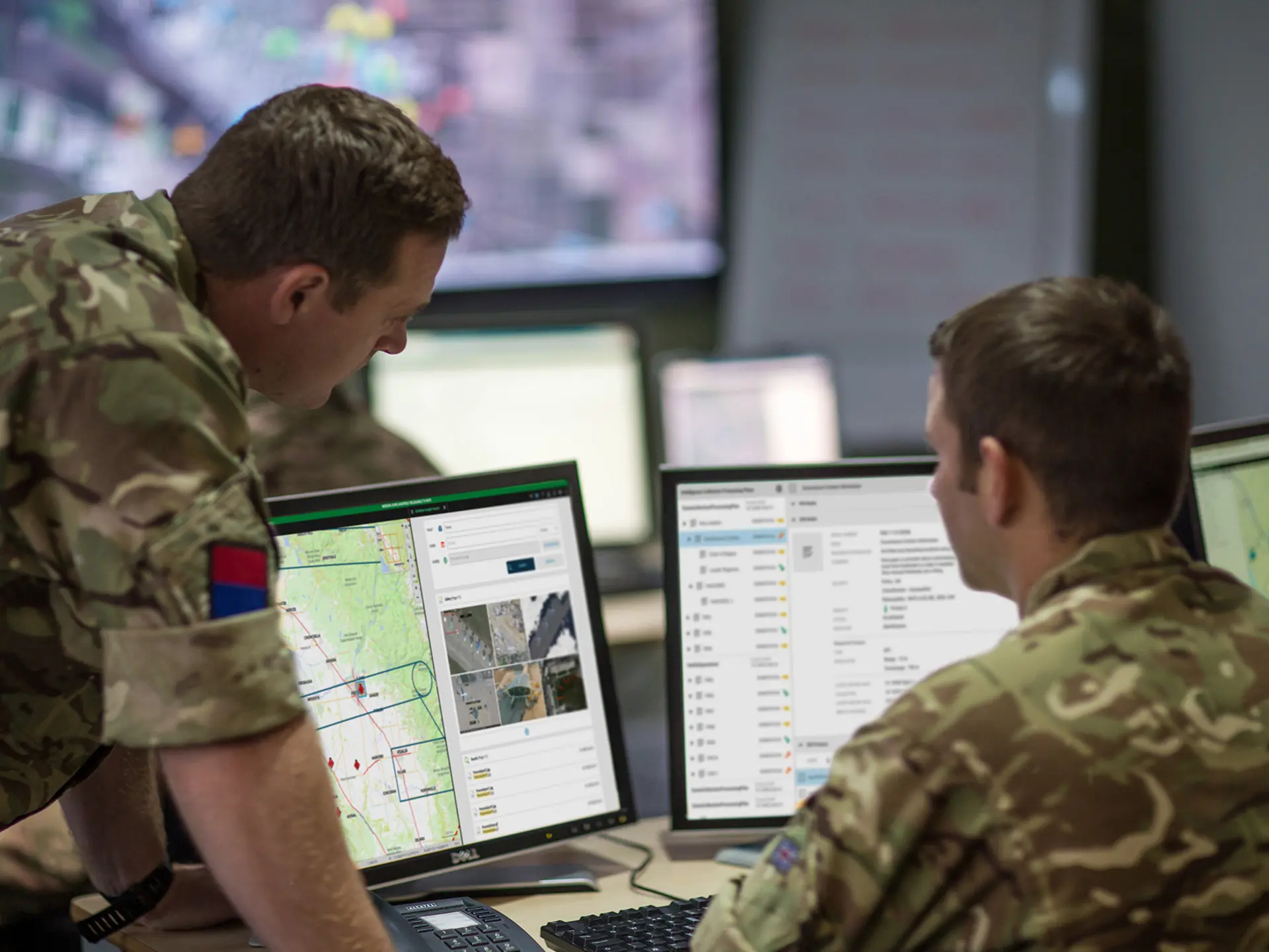 Personnel looking at screens