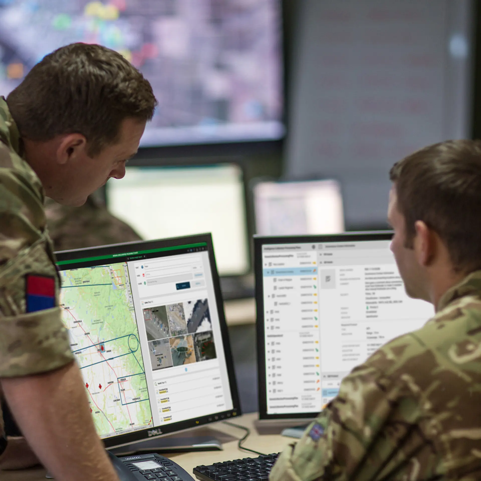 Personnel looking at screens