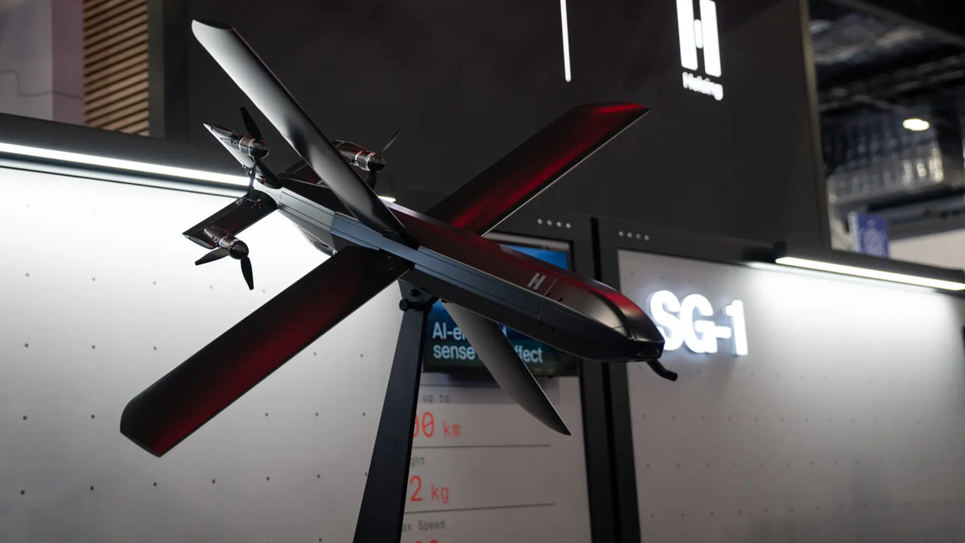 The Helsing HX-2 drone displayed on a stand at DSEI 2025 defense exhibition.