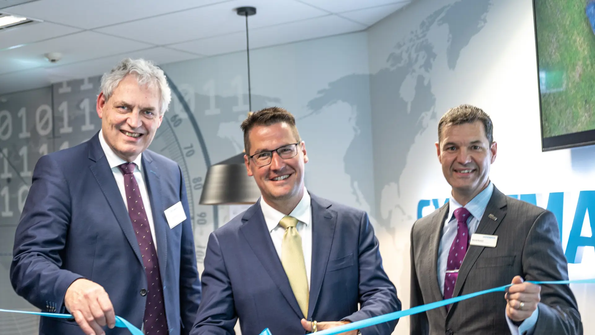 Michael Holm, Systematic founder and CEO; senator Zed Seselja, Australian Capital Territory; and David Horton, Systematic's Vice President for the Asia Pacific Region.
