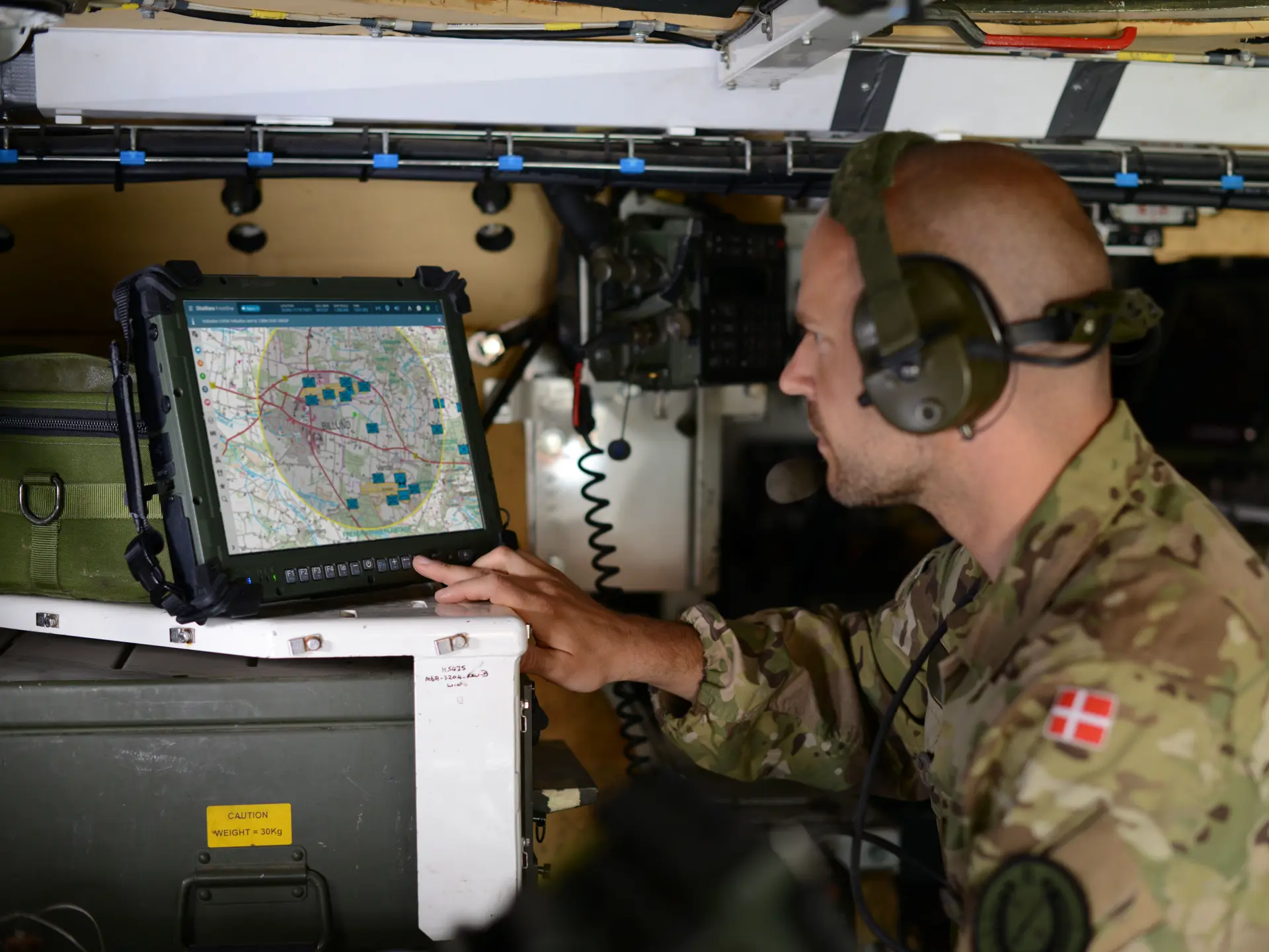 Danish military staff using SitaWare Frontline in a vehicle