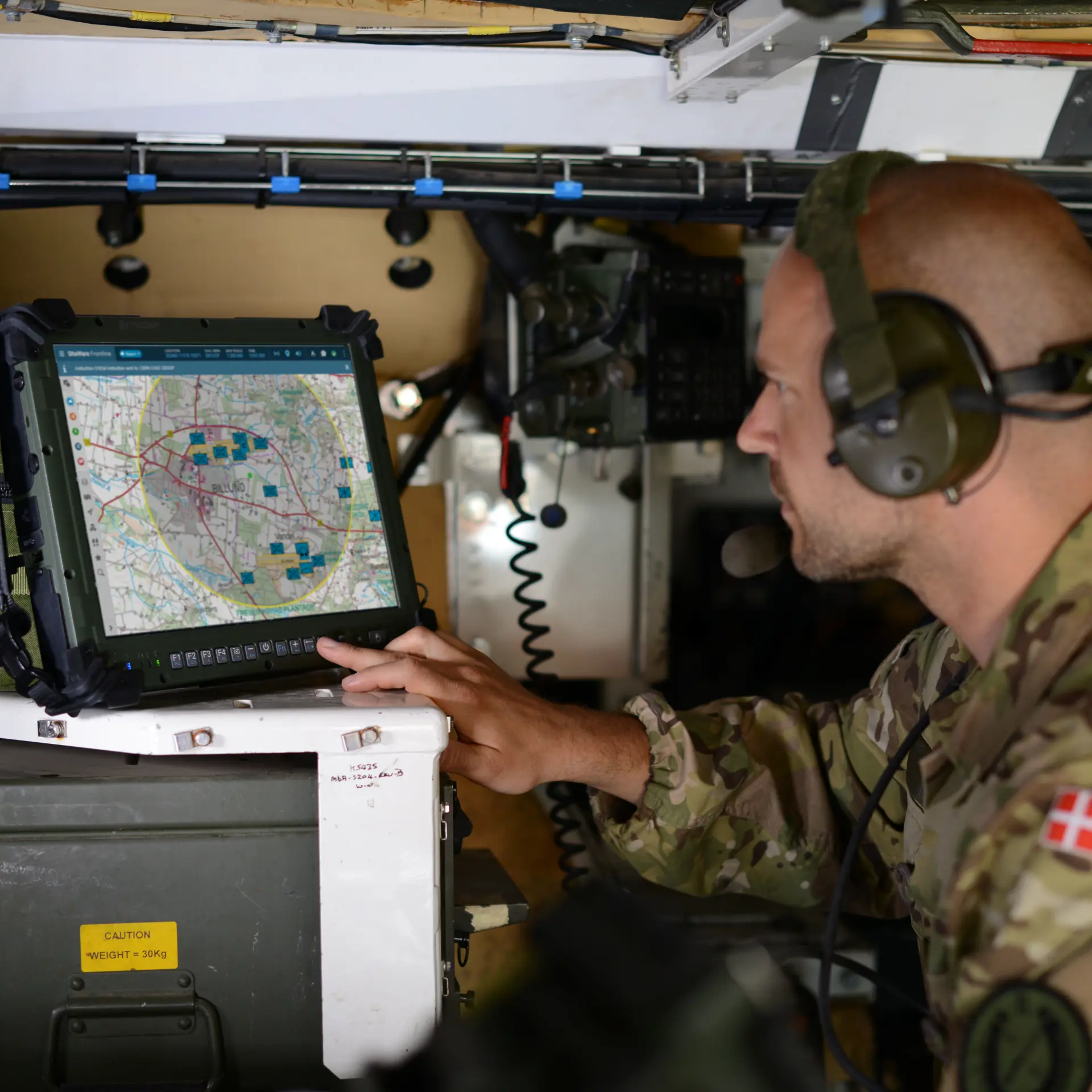 Danish military staff using SitaWare Frontline in a vehicle