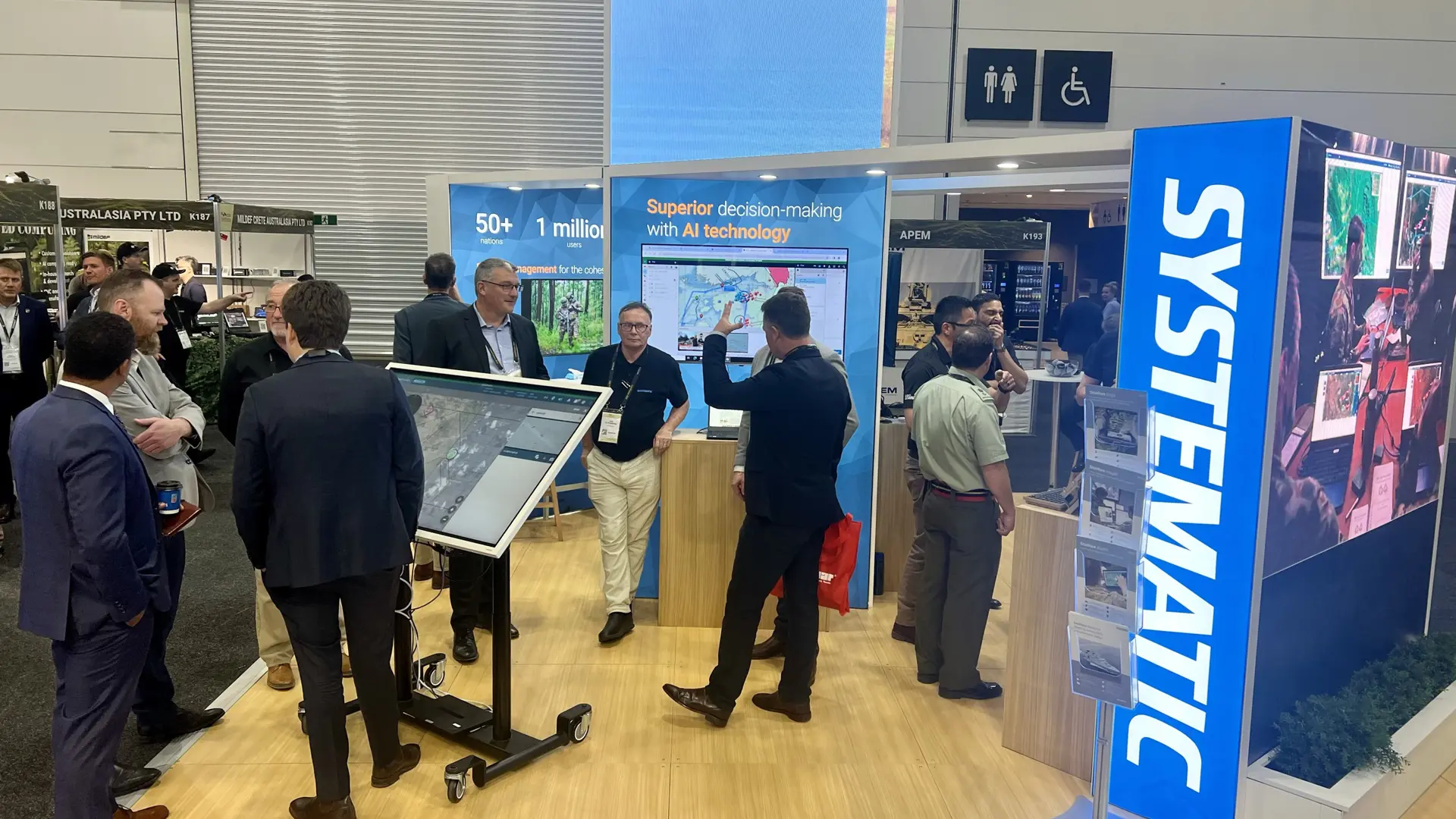 People at Systematic exhibition stand