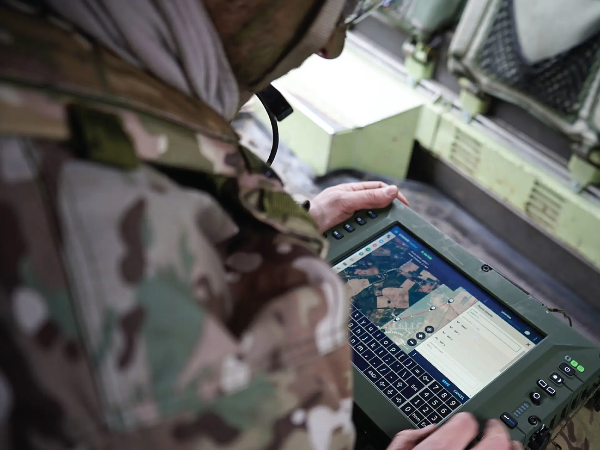 Soldier looking at tablet with SitaWare Frontline