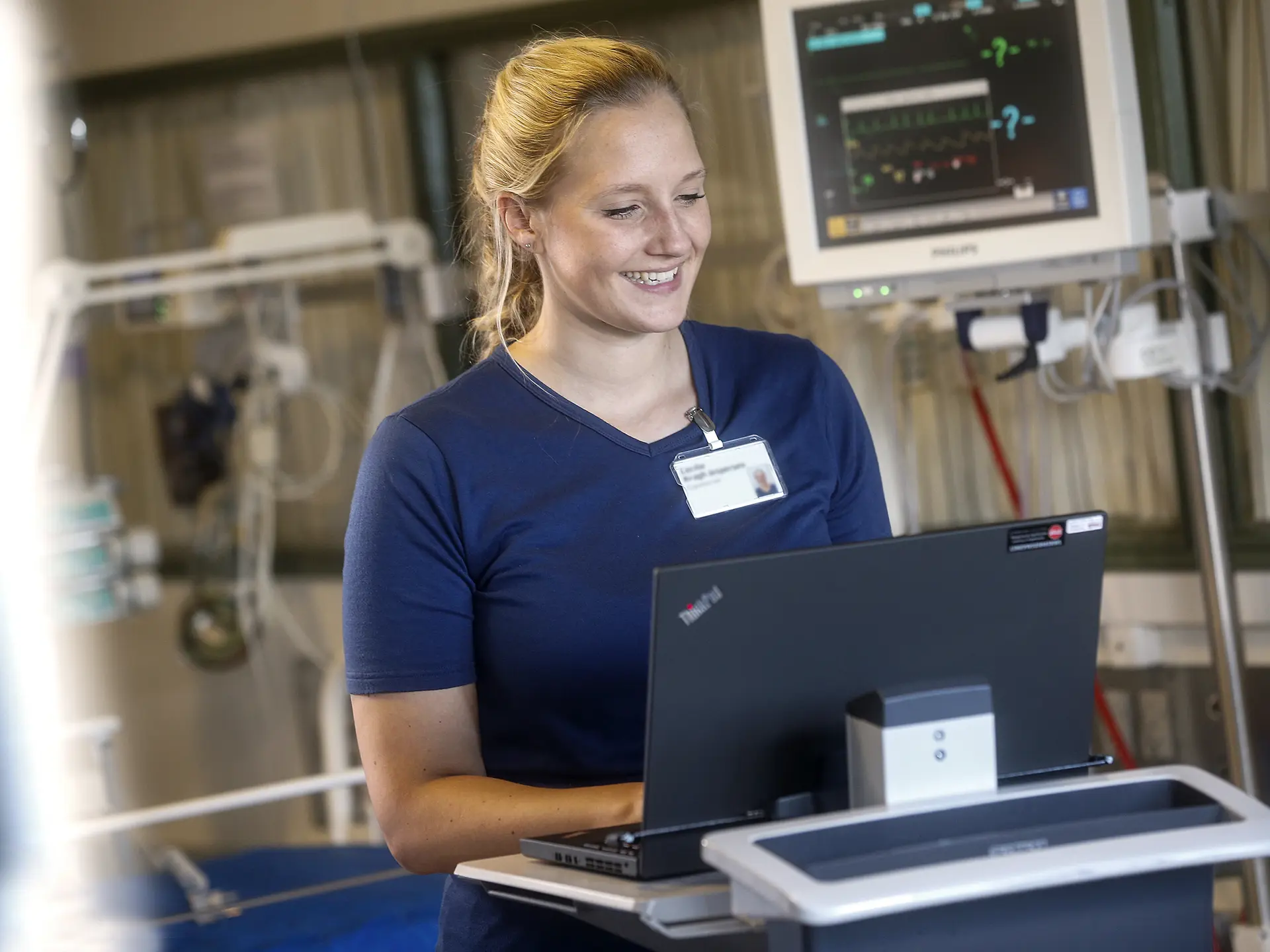 Nurse working on computer in emergency department