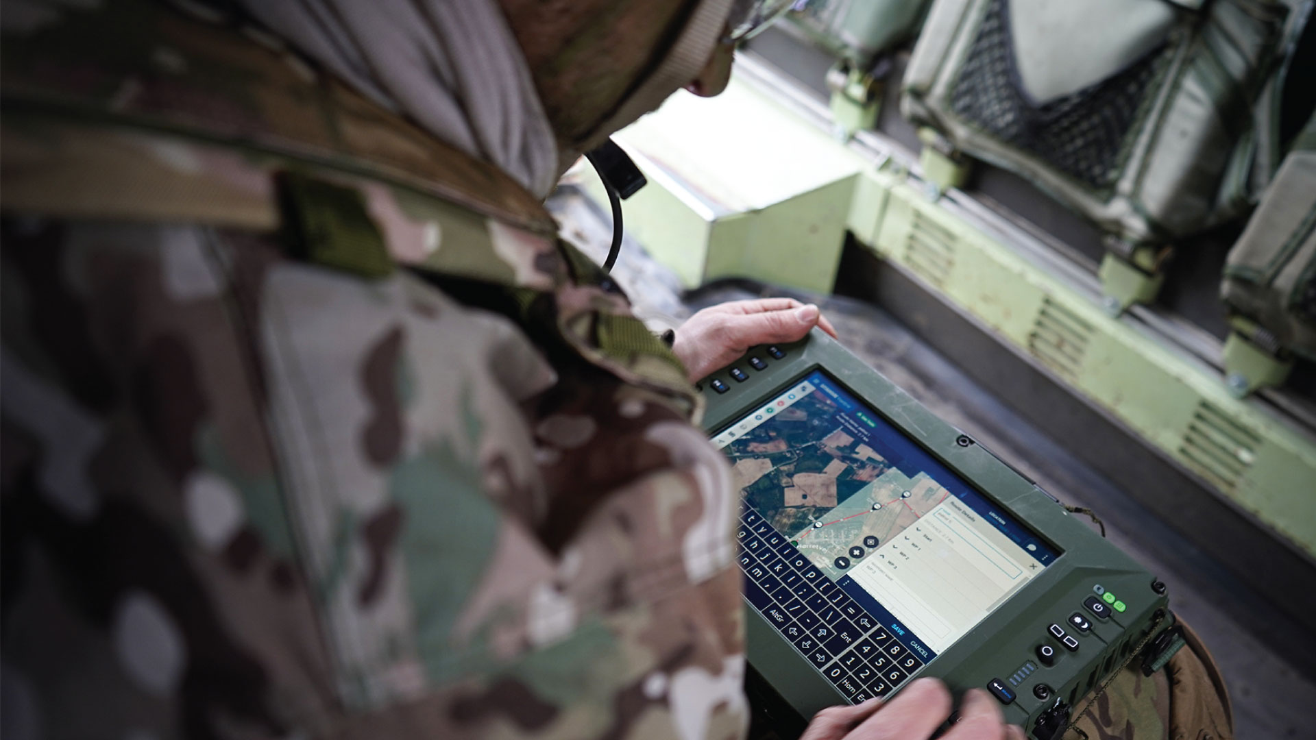 Military man using SitaWare Frontline 3.0 on a tablet