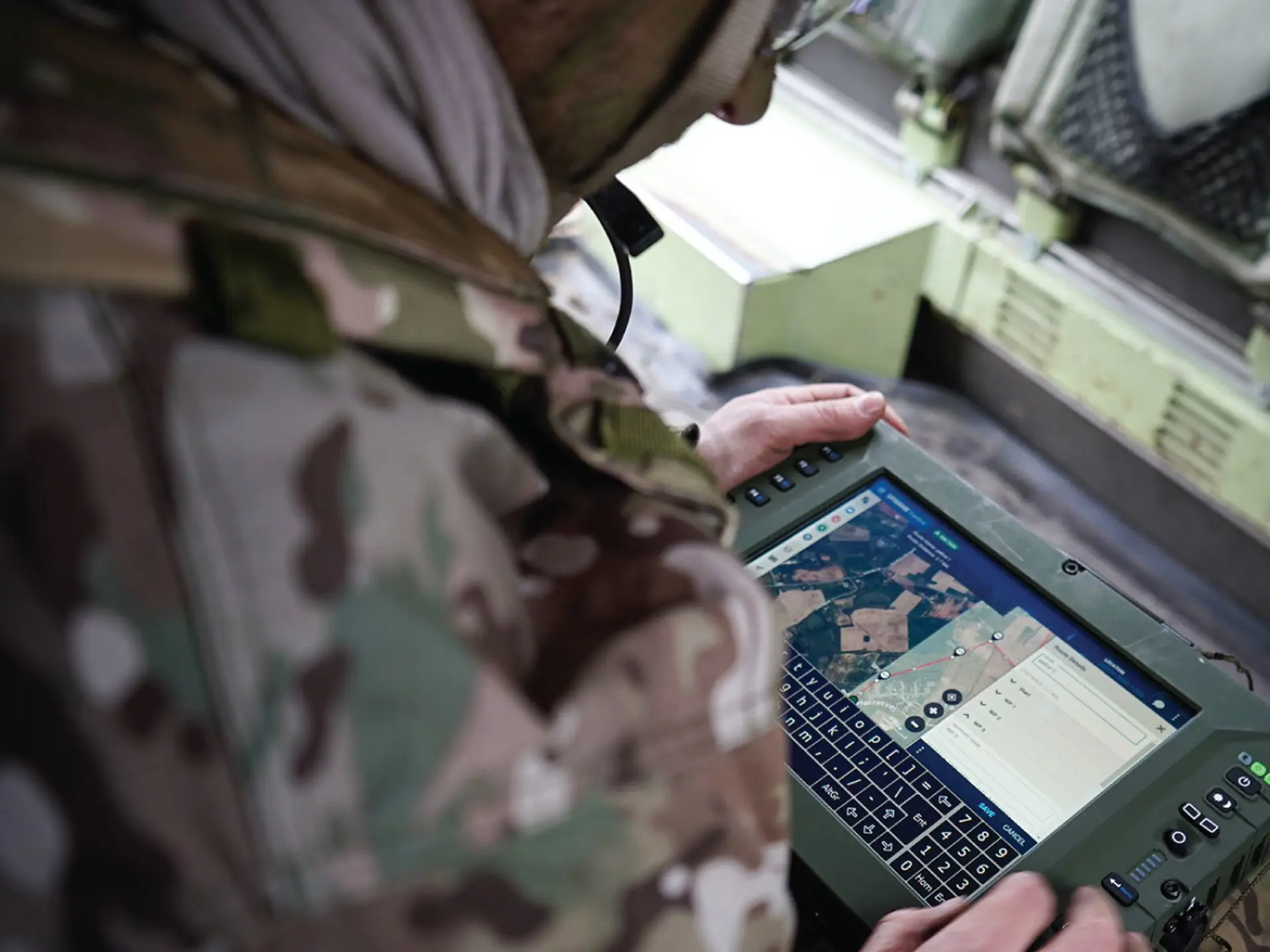 Military man using SitaWare Frontline 3.0 on a tablet