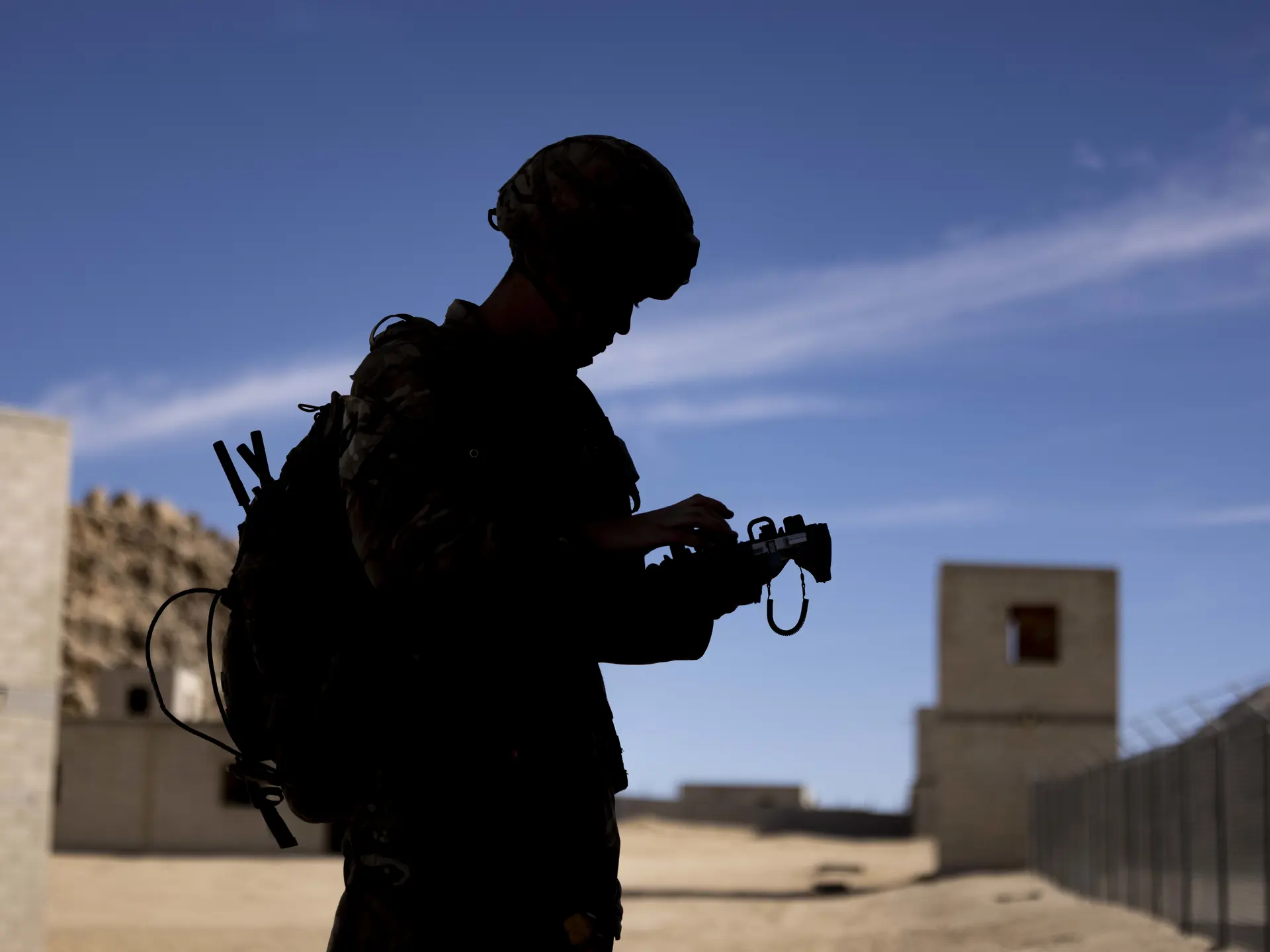 Soldier in shadow using C4ISR technology with SitaWare software