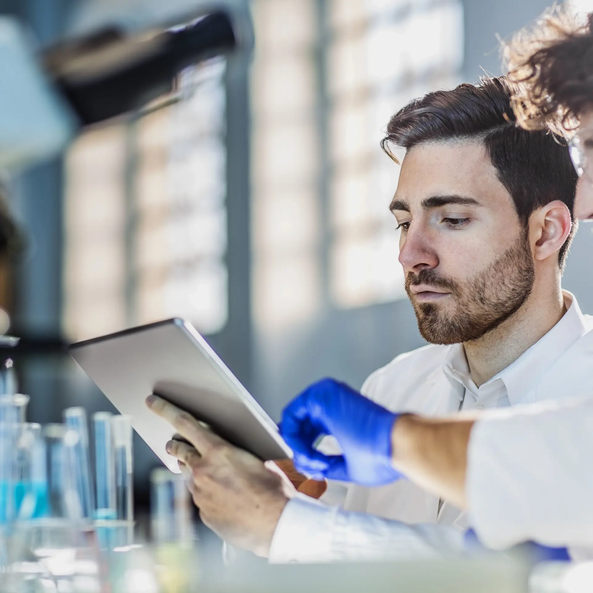 Clinical staff with a patient record in a laboratory