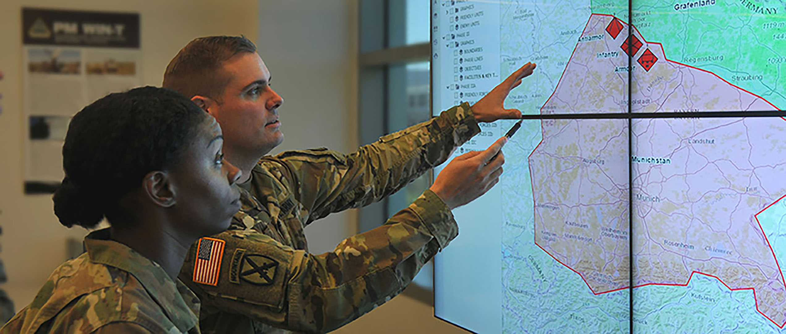 US Commanders Pointing On Screens With Digital Map