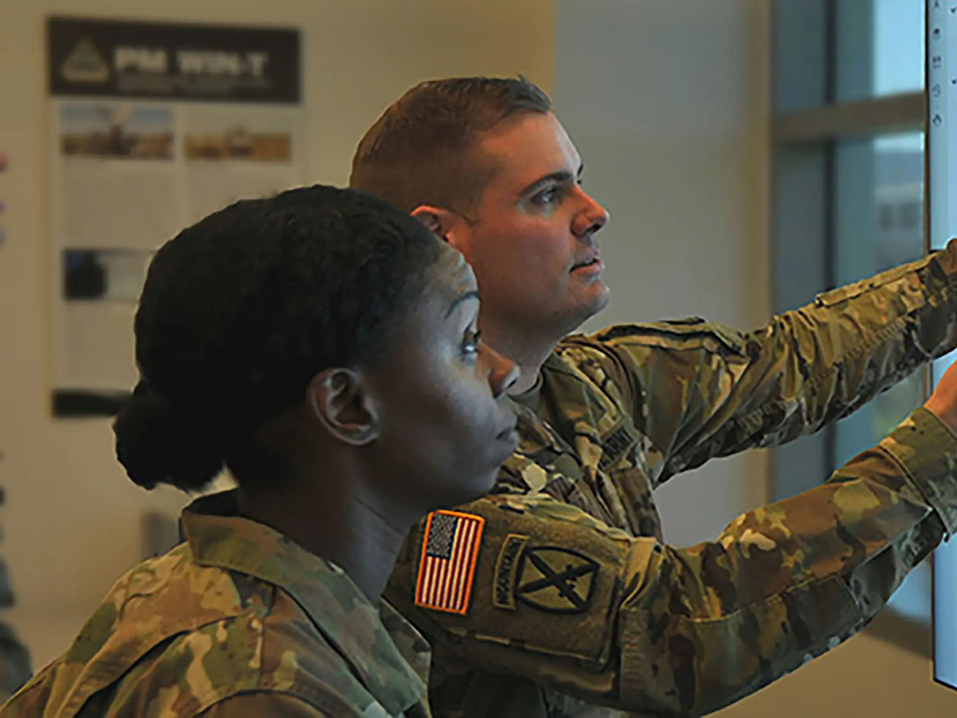 US Commanders Pointing On Screens With Digital Map