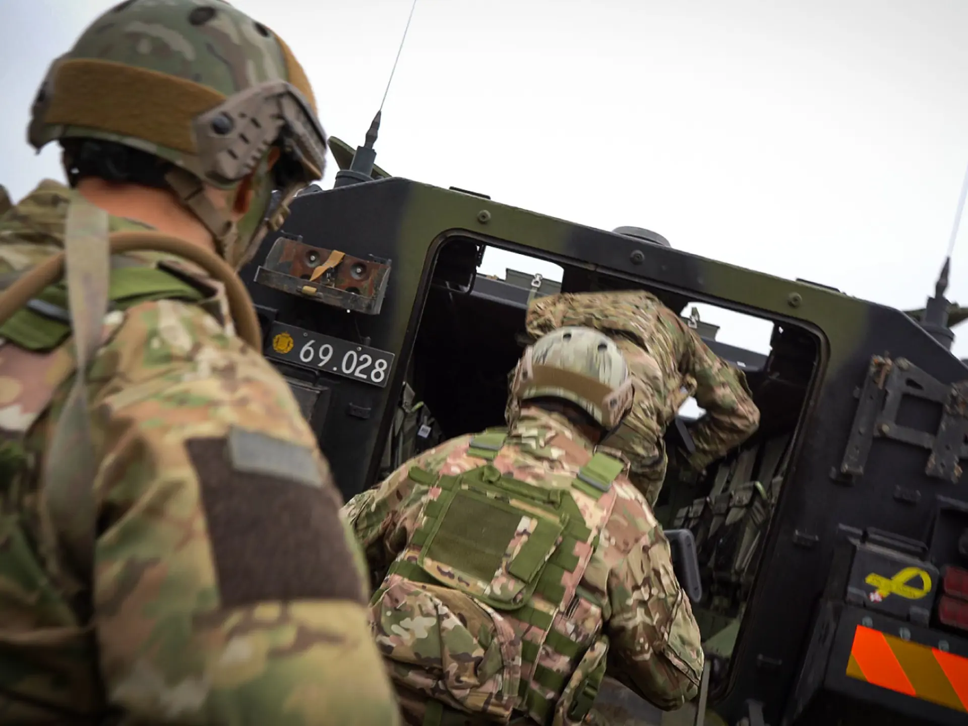frontline soldiers getting into vehicle