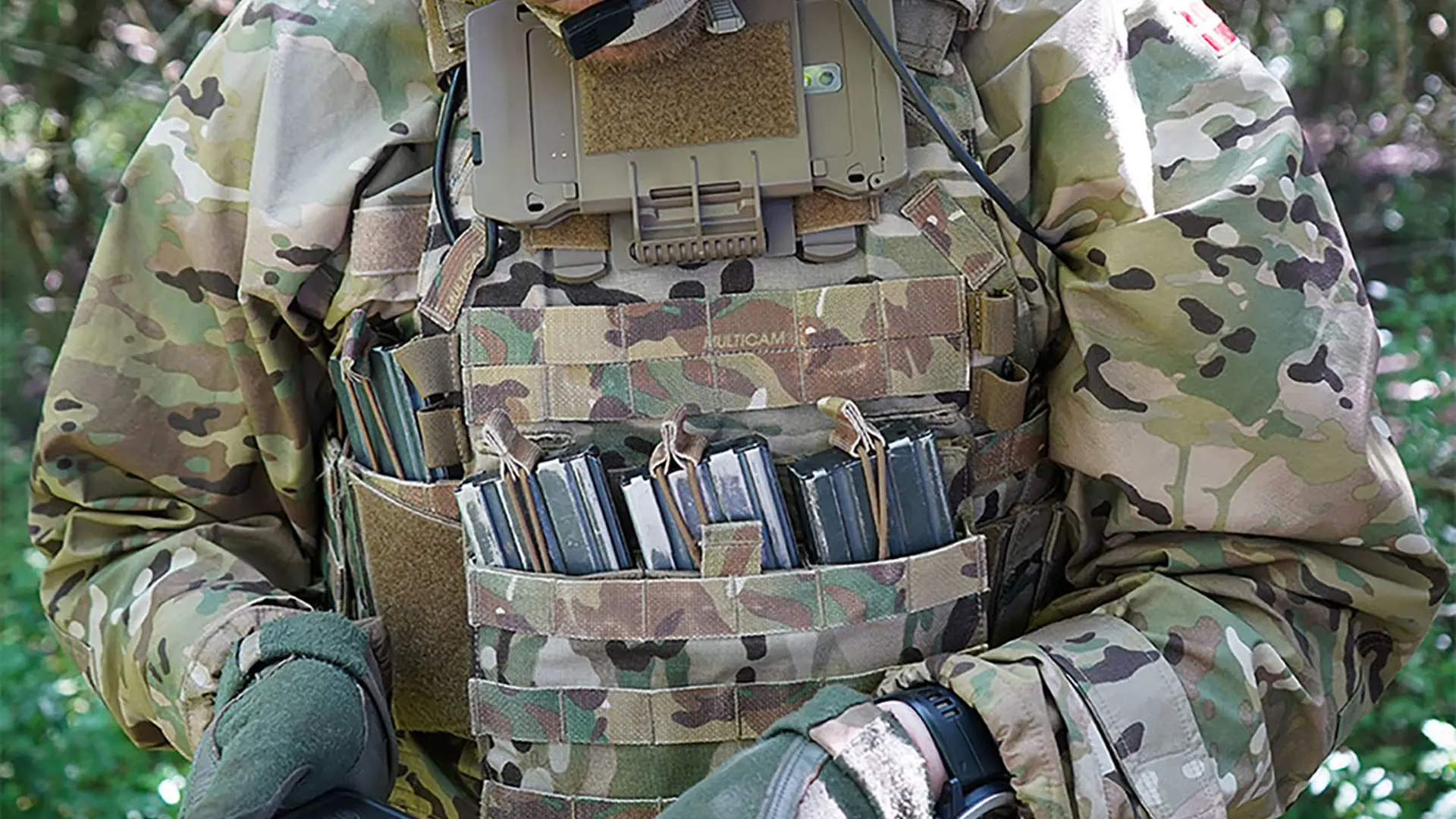 Soldier  in the woods with device with SitaWare Edge