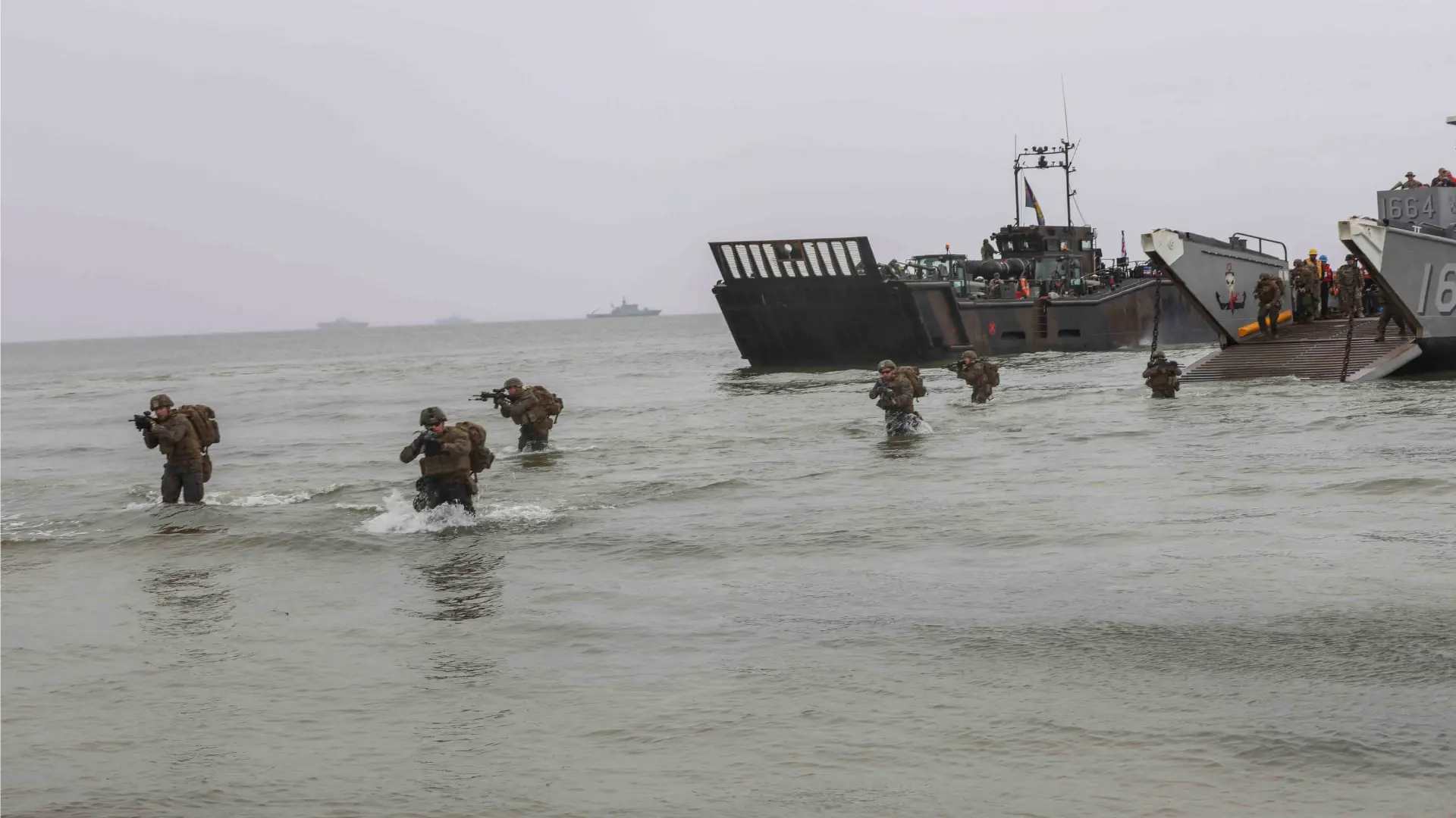U.S. Marines march to the beach in an amphibious assault exercise