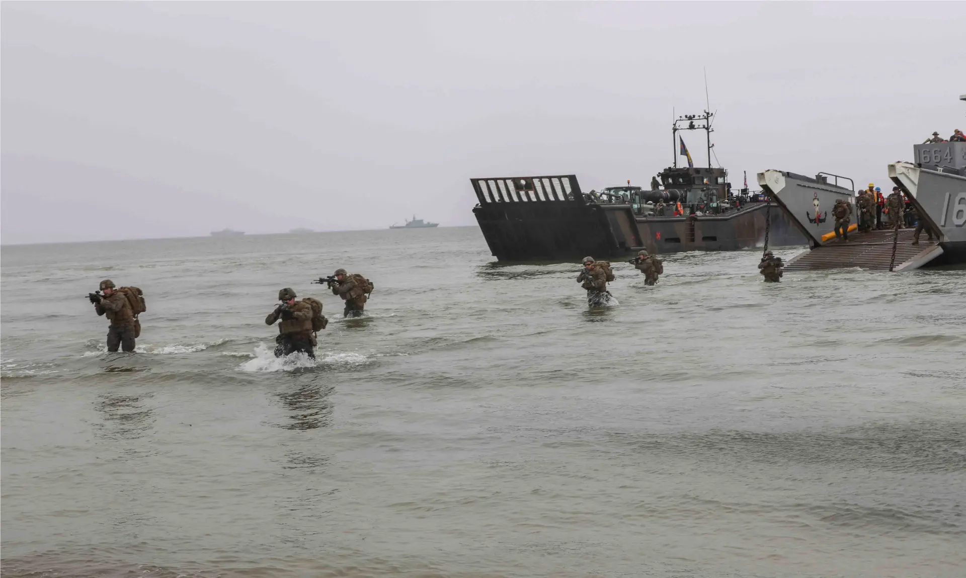 U.S. Marines march to the beach in an amphibious assault exercise