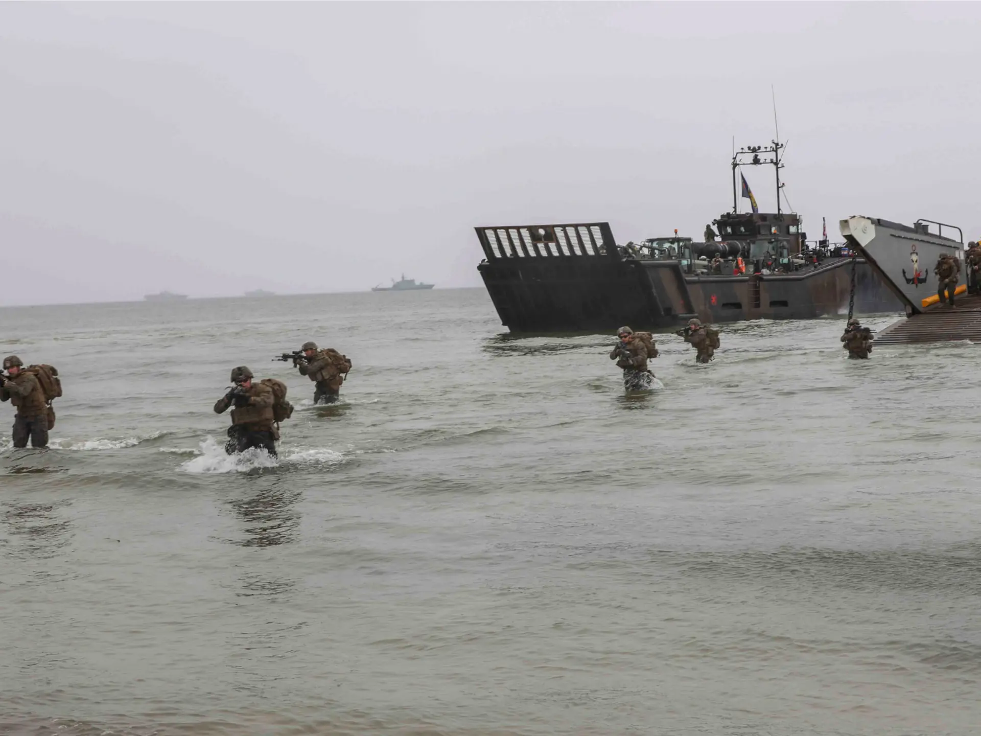 U.S. Marines march to the beach in an amphibious assault exercise