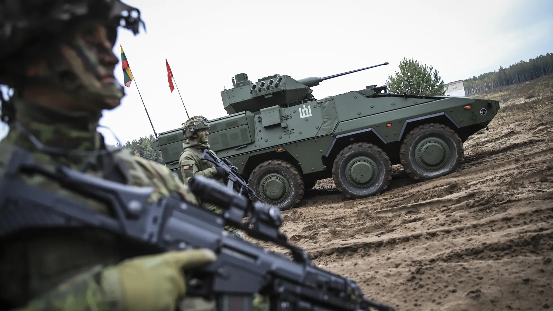 Lithuanian soldiers and tank