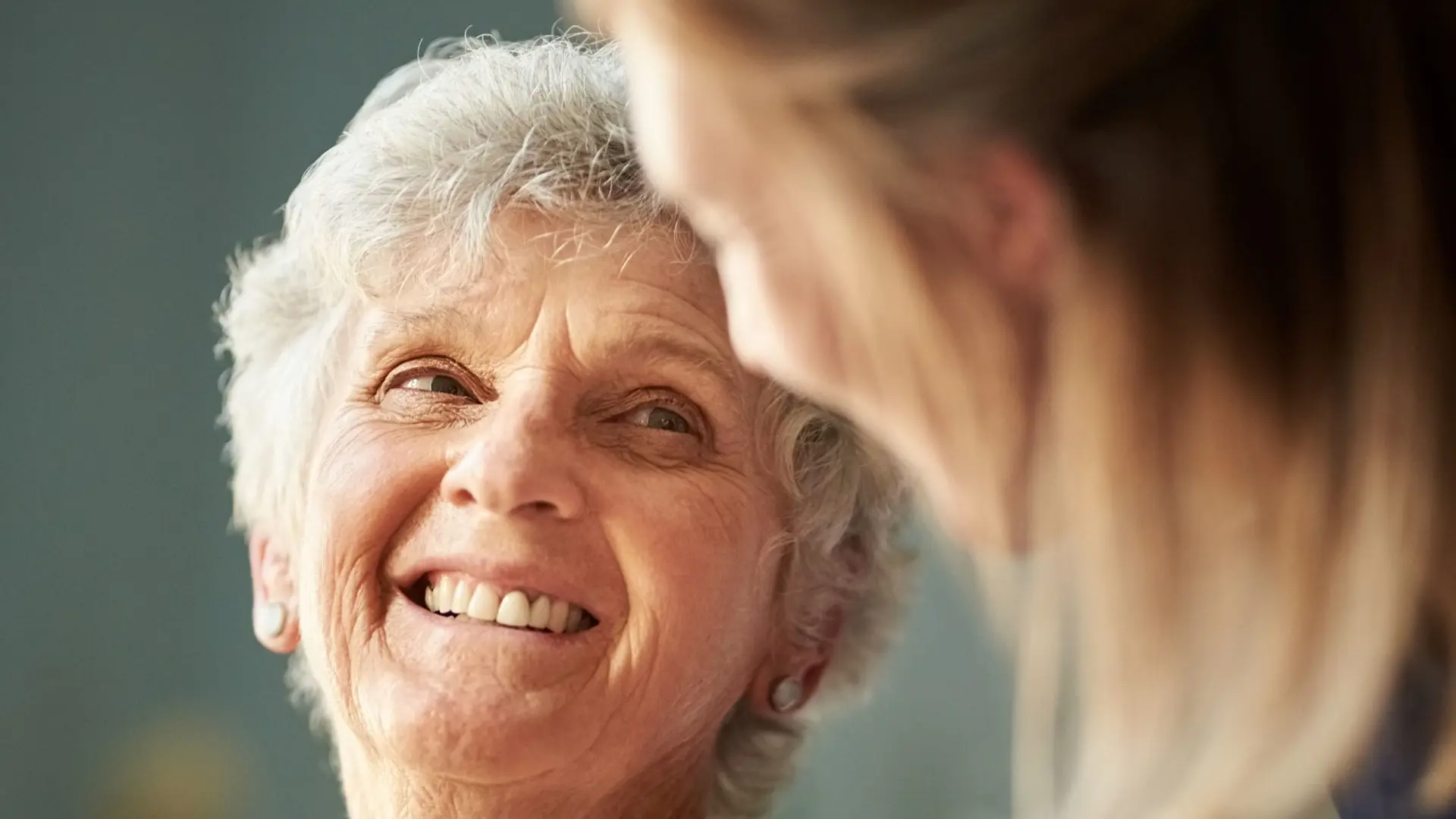 Older woman and social and healthcare assistant