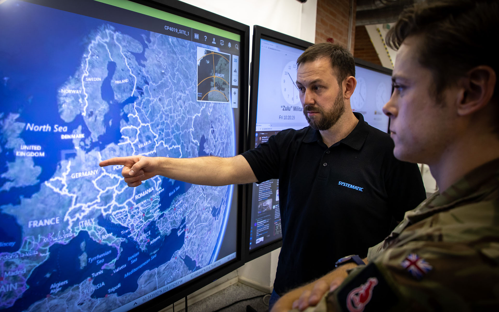 Senior systems engineer at Systematic David Lewis demonstrates SitaWare Headquarters in Lithuania to UK forces