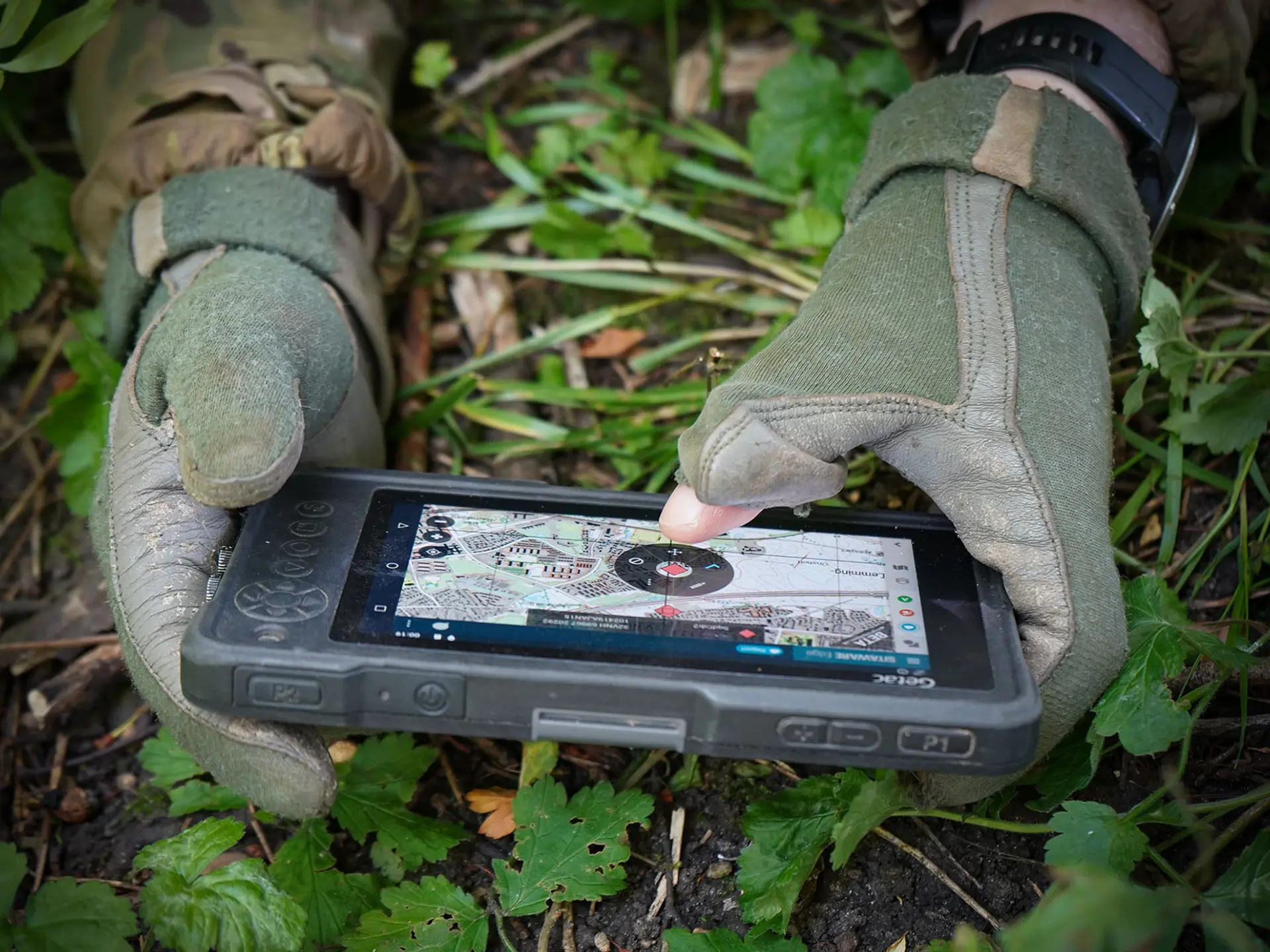 UK Soldier On The Ground Holding Sitaware Edge Device