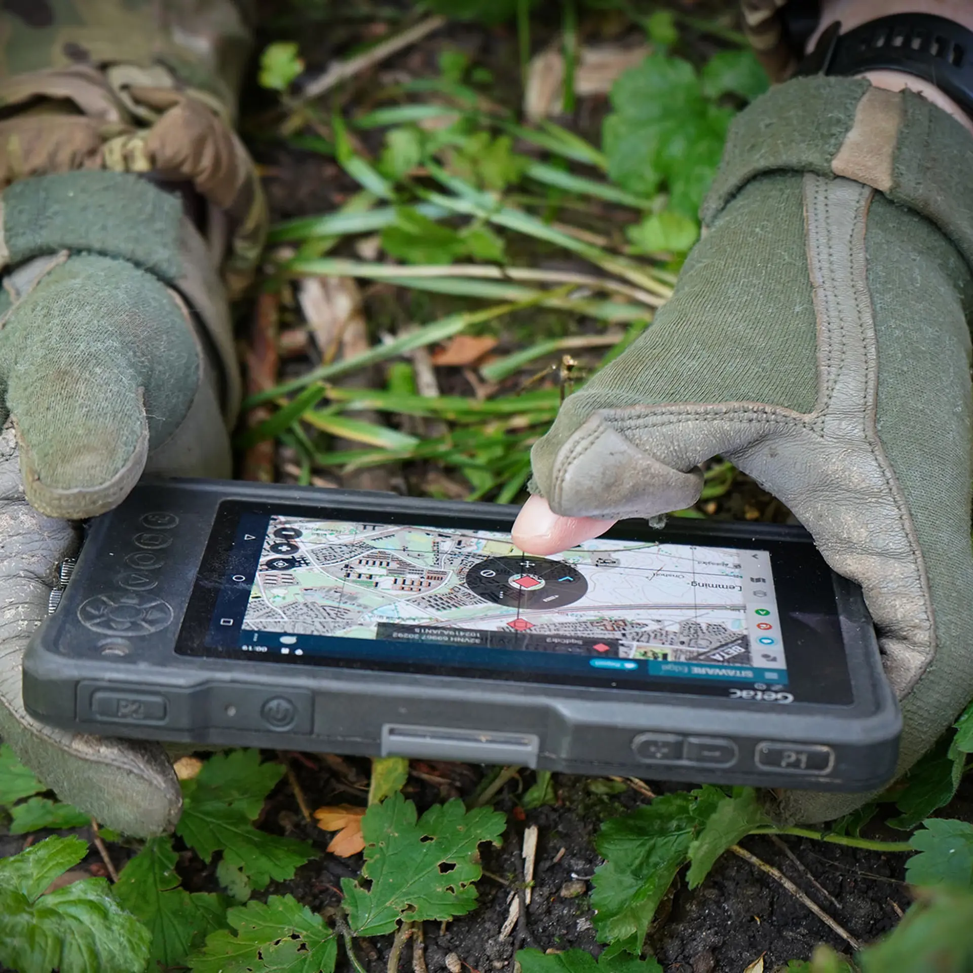 UK Soldier On The Ground Holding Sitaware Edge Device