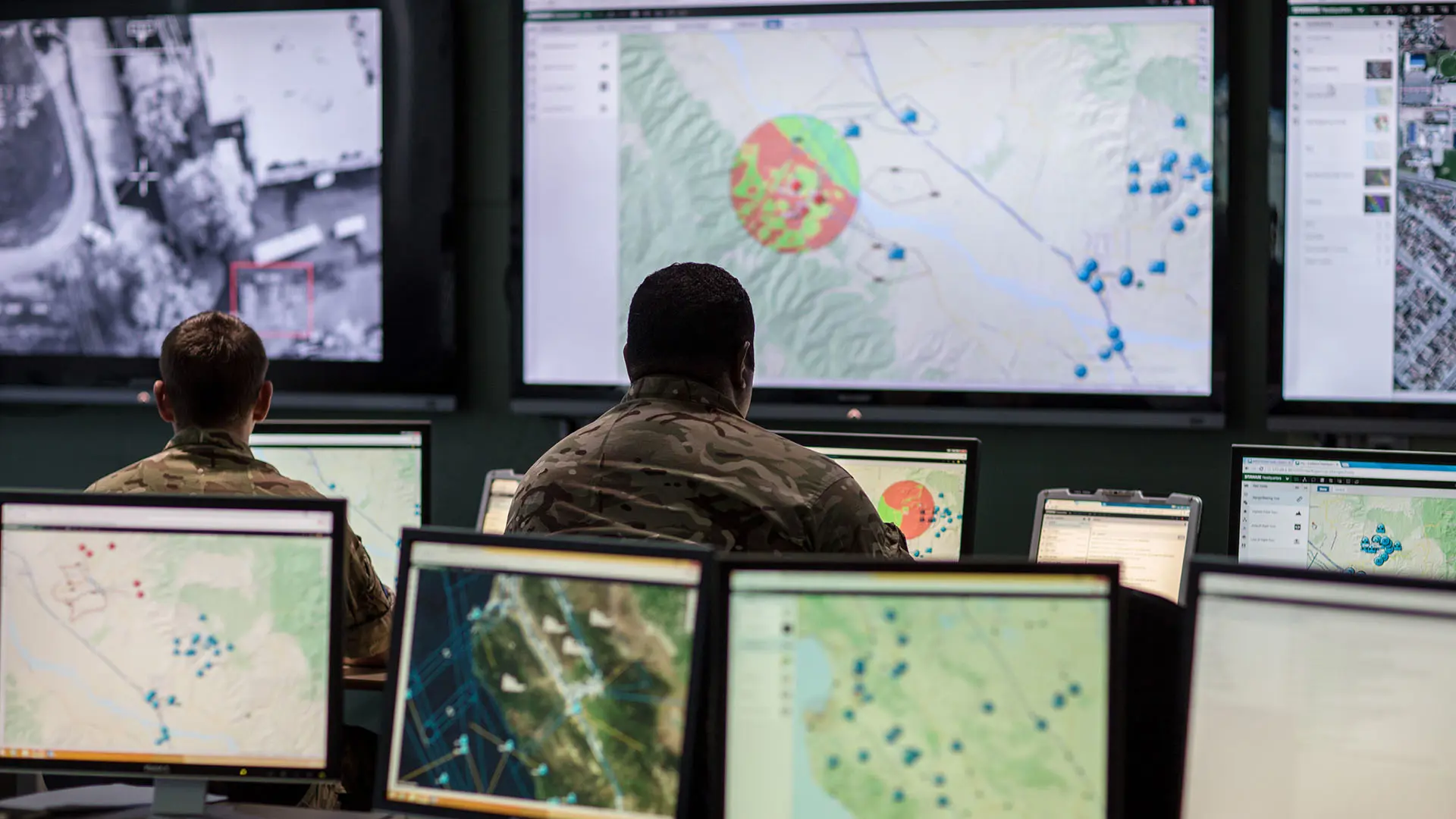 UK Commander Looking At Sitaware Map In HQ