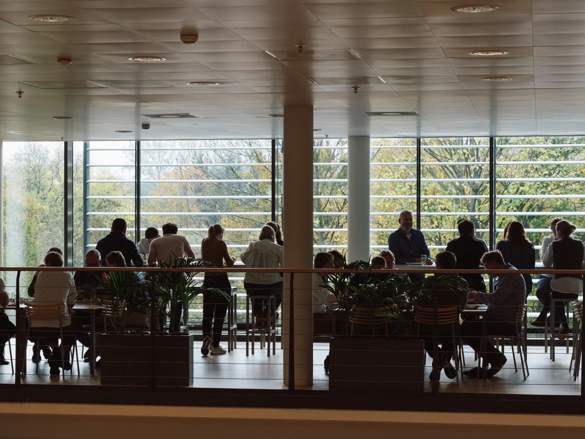 Employees eating lunch in the canteen at Systematic's head office in Aarhus, Denmark