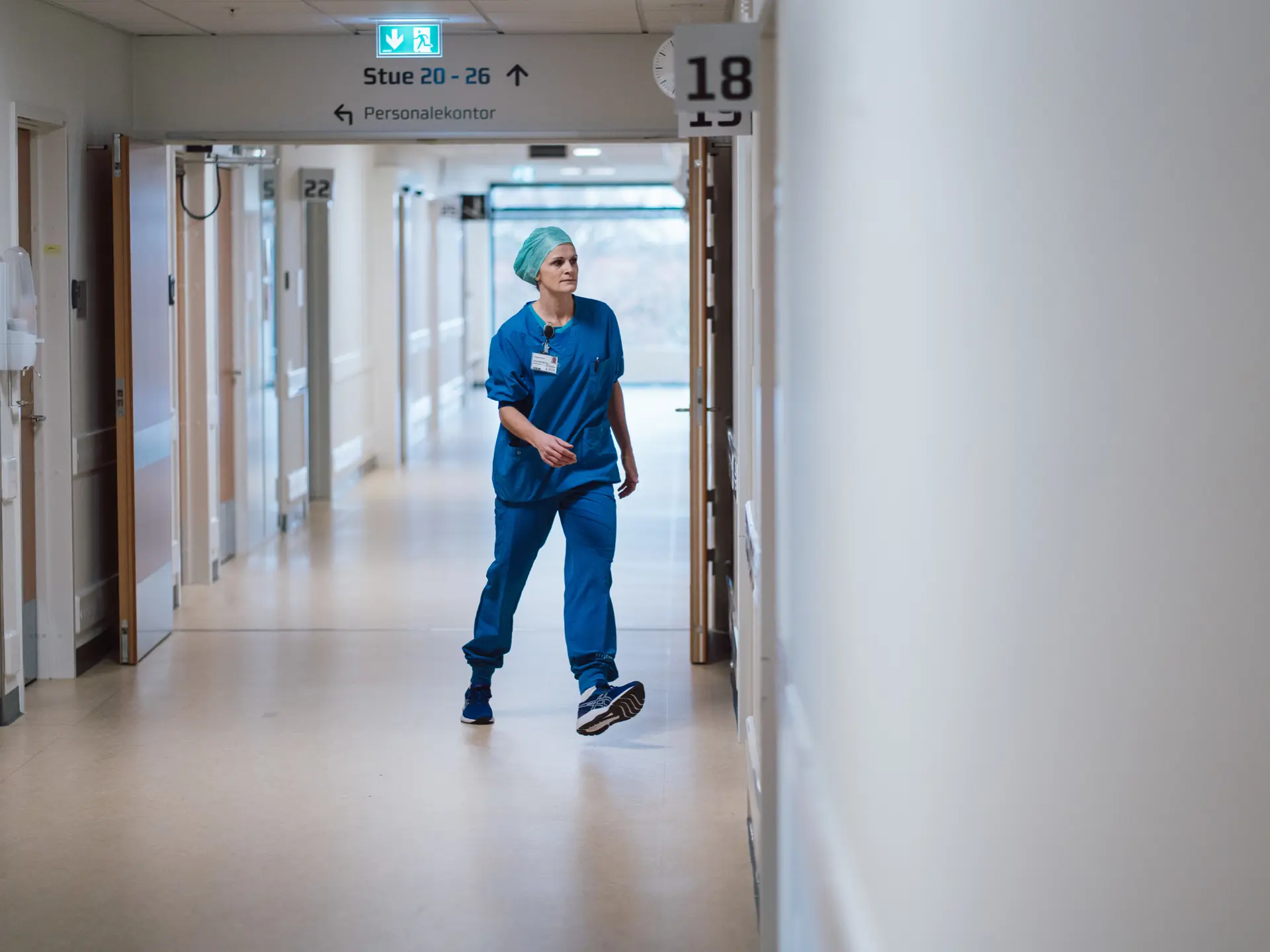 Healthcare professionals in the hospital hallway