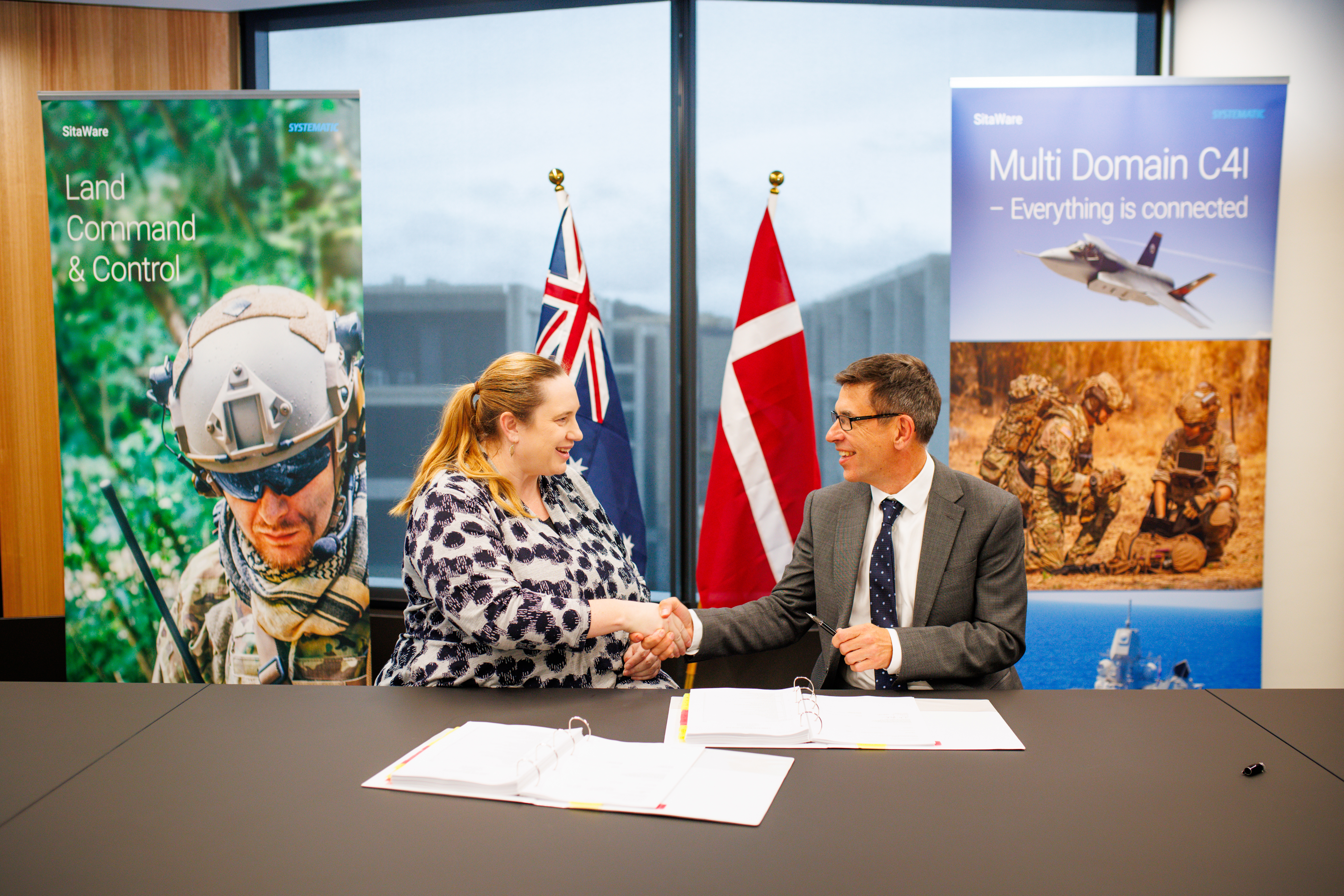 Andrew Graham, Group Senior Vice President of Defence Sales, Systematic, and Erin Stonestreet, Assistant Secretary LC4S, the Australian Department of Defence, at the signing of the Land 4140 contract.