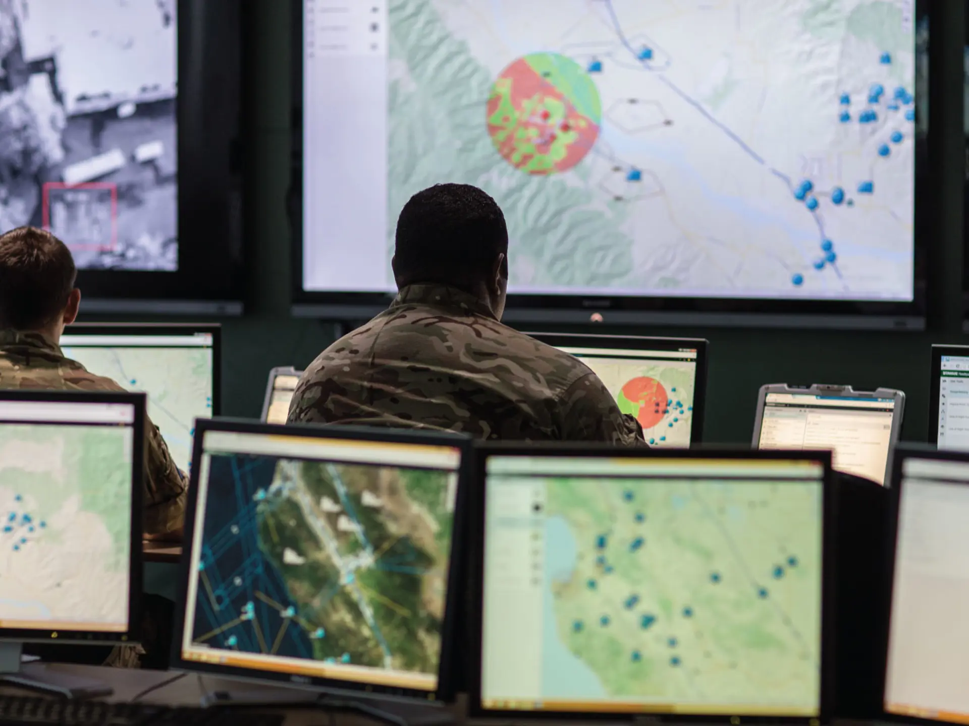 Military men looking at Sitaware Headquarters in war room