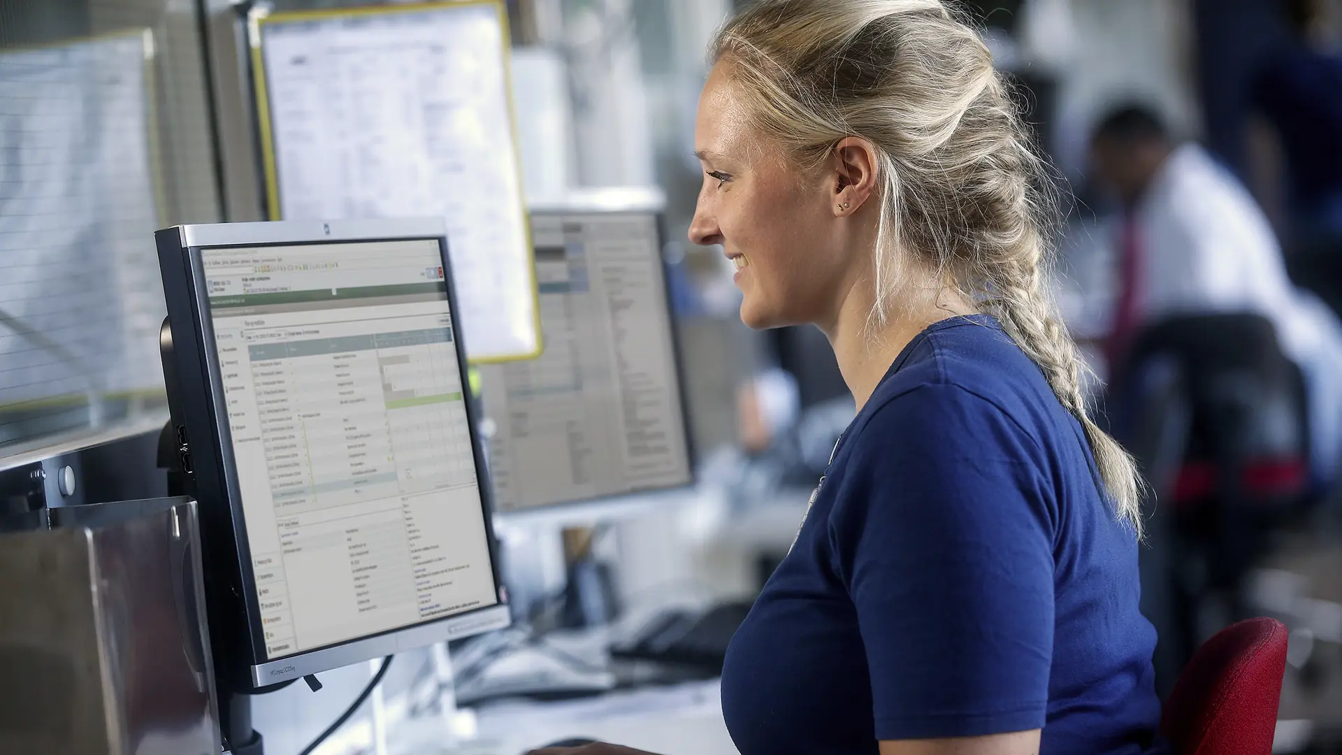 Nurse sitting at computer working in the electronic patient record