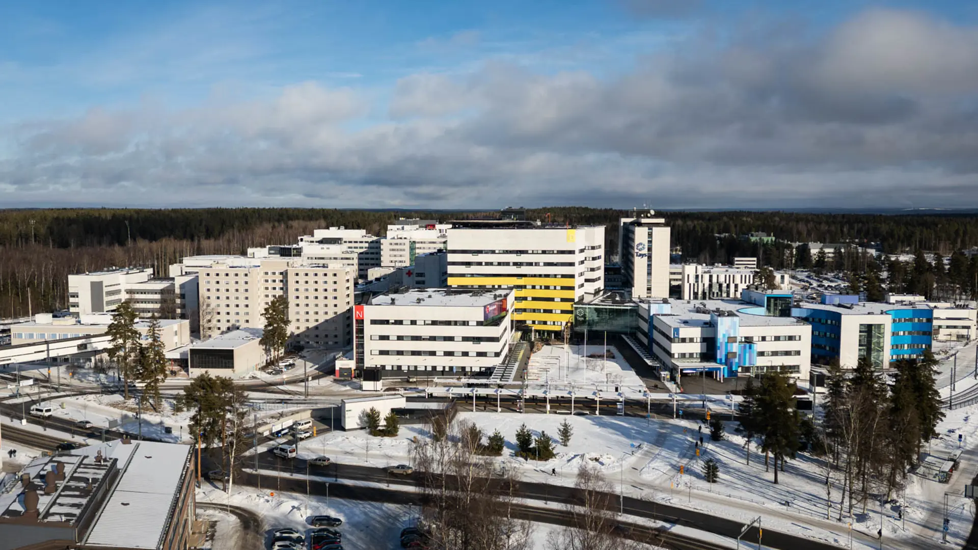 Aerial drone view of Tampere University Hospital, showcasing the hospital buildings and surrounding area.