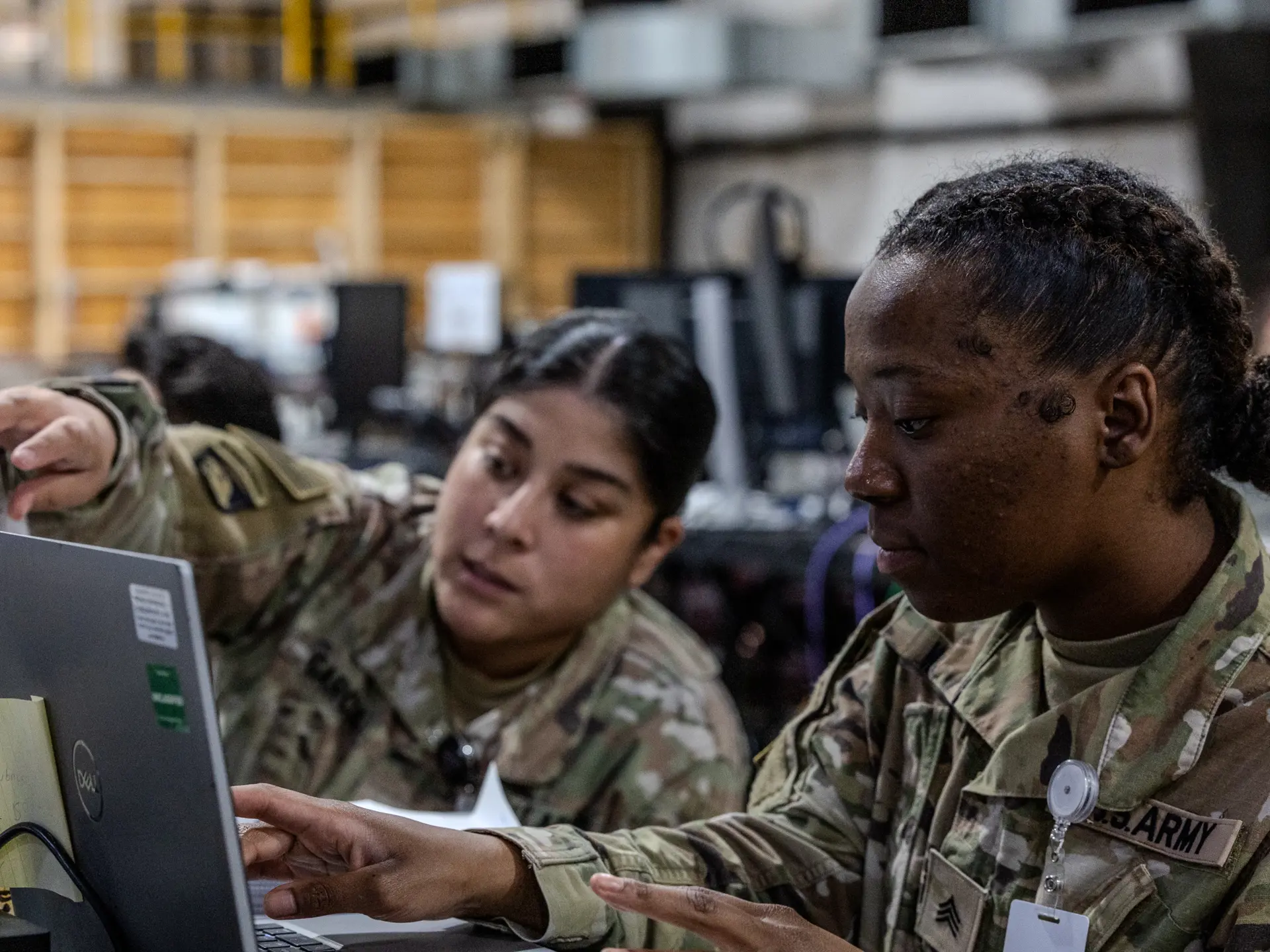 Two soldiers looking at a screen during the WFX 25 exercise in May