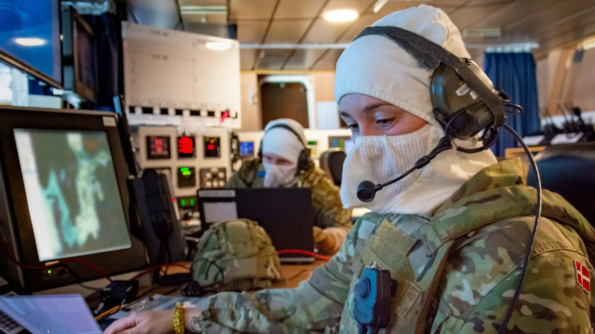 Soldier in a command room