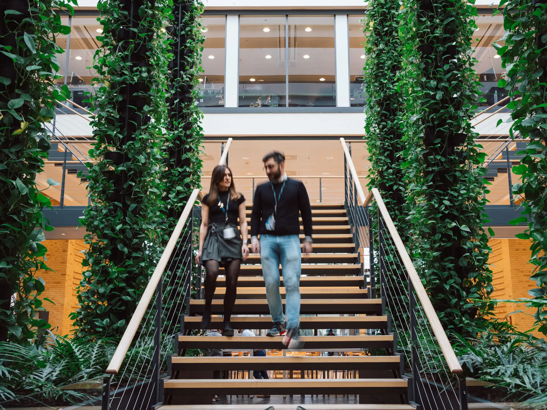 Systematic employees walking on stairs in Systematic Headquarters