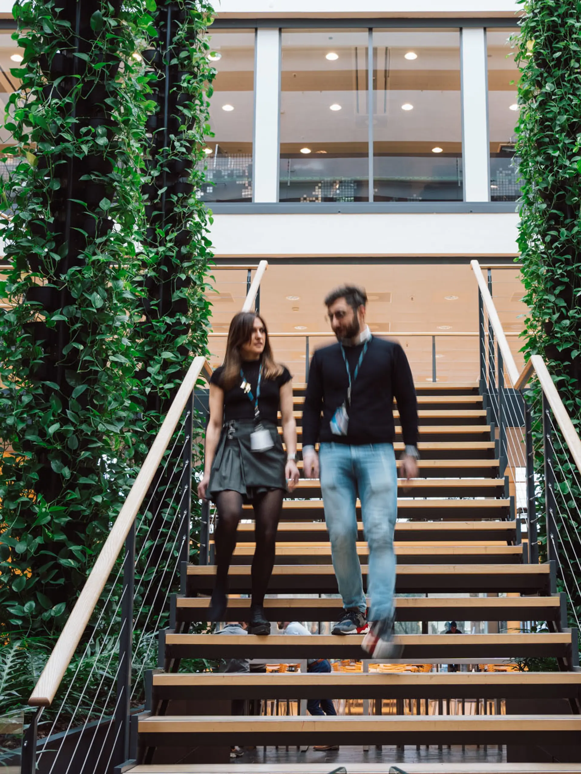 Systematic employees walking on stairs in Systematic Headquarters