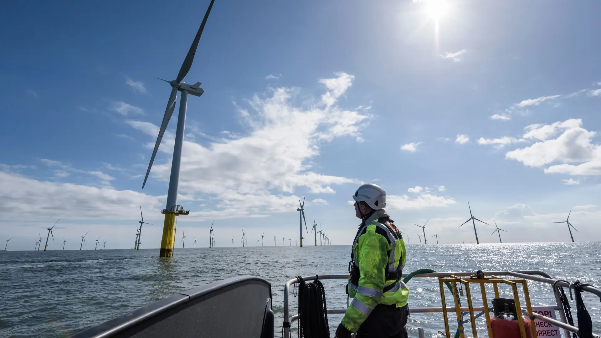 Operator in front of a wind mill