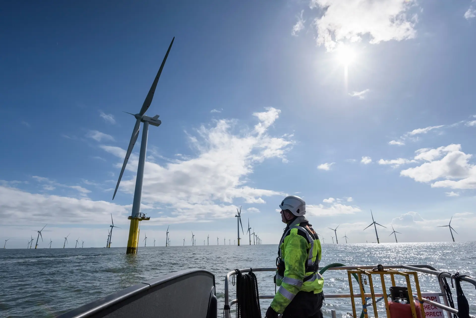Operator in front of a wind mill