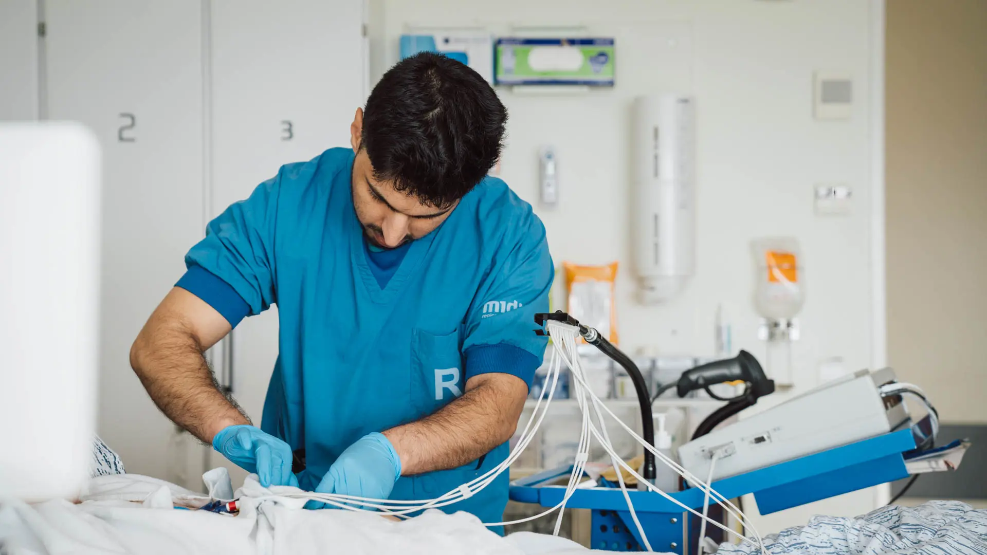 Male nurse working with medical equipment