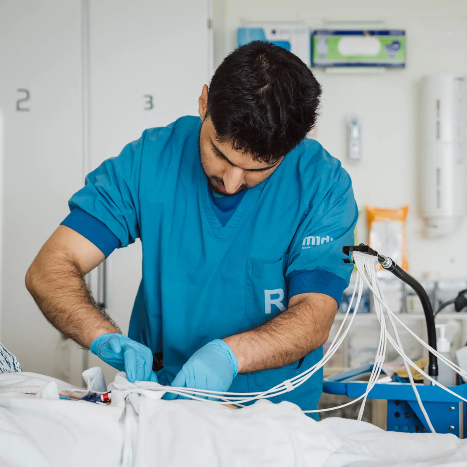 Male nurse working with medical equipment